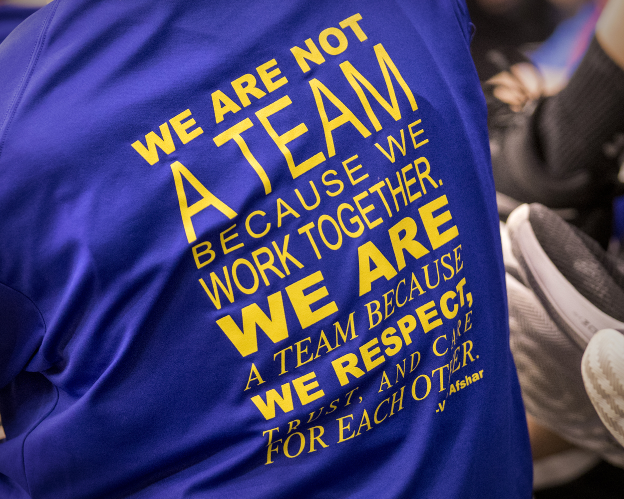 T-shirt with text: We are not a team because we work together. We are a team because we respect, trust, and are for each other.